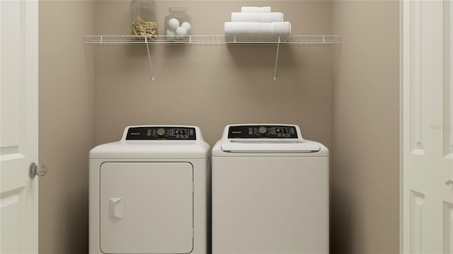 laundry area with separate washer and dryer