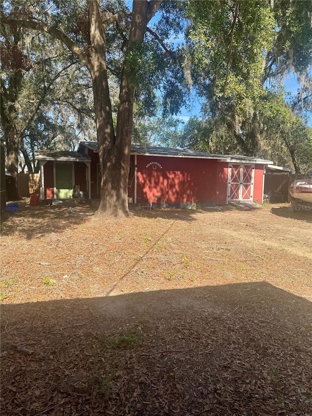 exterior space featuring an outbuilding