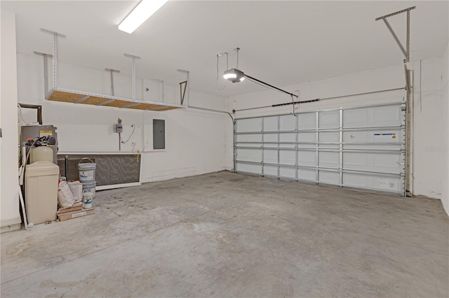 garage featuring a garage door opener and electric panel