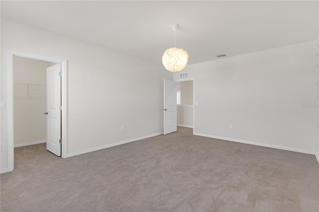 unfurnished room featuring carpet