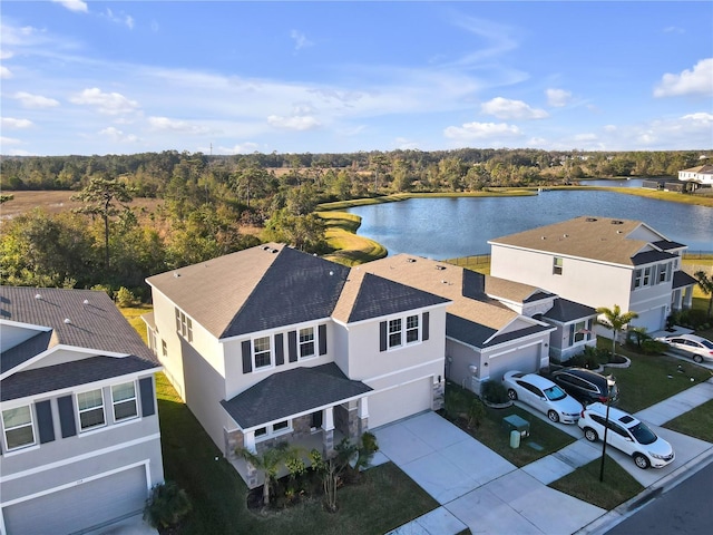 birds eye view of property featuring a water view