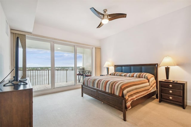 bedroom with ceiling fan, light carpet, and access to outside