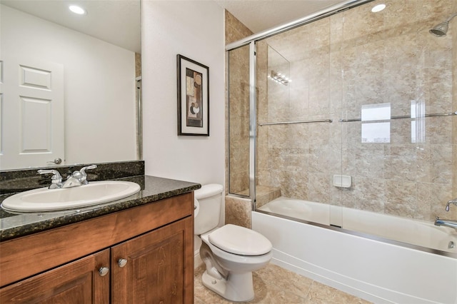 full bathroom with vanity, tile patterned floors, toilet, and combined bath / shower with glass door