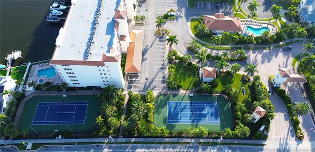 birds eye view of property with a water view