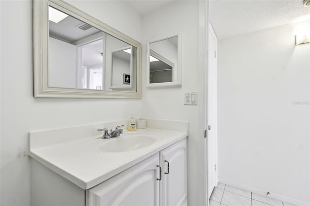 bathroom featuring vanity and a textured ceiling