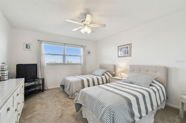 bedroom with light carpet and ceiling fan