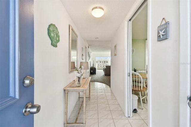 hallway with light tile patterned floors