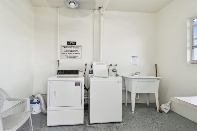 clothes washing area featuring washing machine and clothes dryer