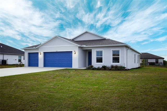 view of front of home featuring a garage and a front lawn