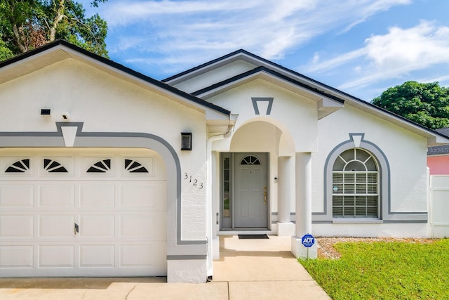 view of front of property with a garage