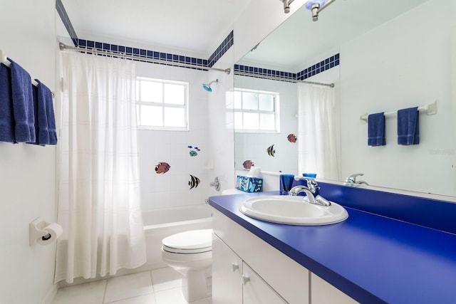 full bathroom featuring tile patterned floors, toilet, vanity, and shower / bath combo