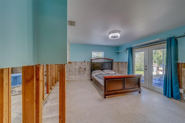 bedroom with access to exterior and french doors