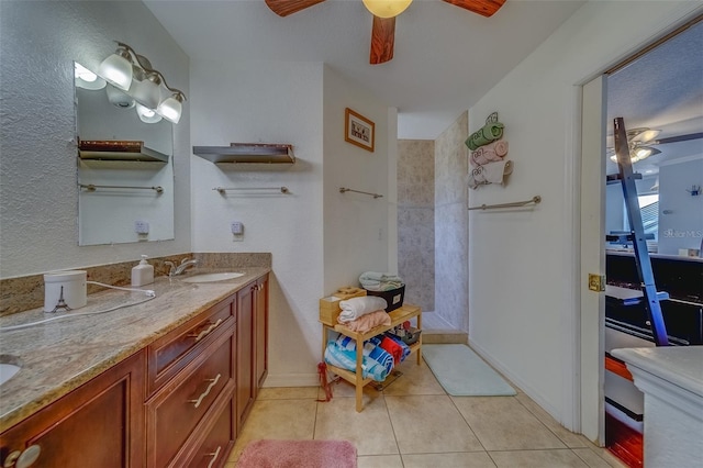 bathroom featuring tile patterned flooring, vanity, and ceiling fan