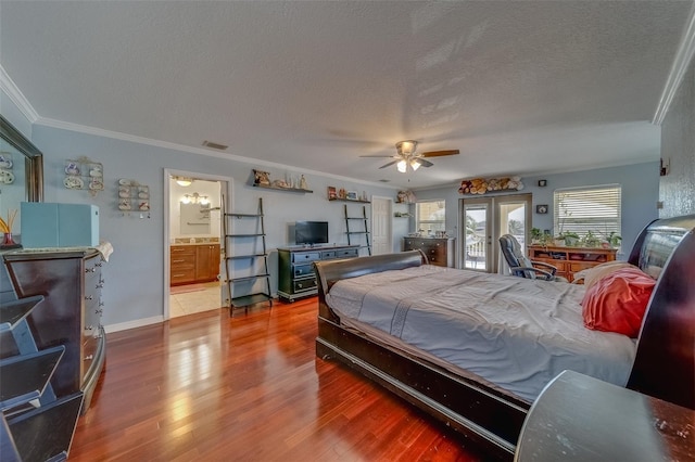 bedroom featuring a textured ceiling, access to outside, and wood-type flooring