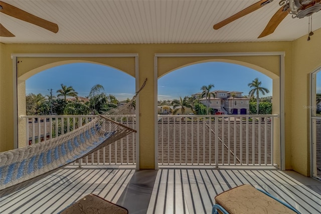 wooden terrace featuring ceiling fan