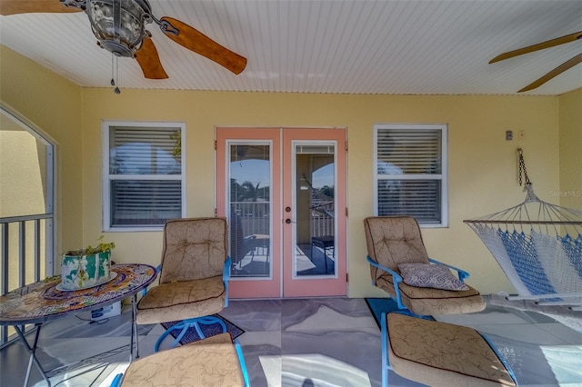 view of patio with french doors and ceiling fan