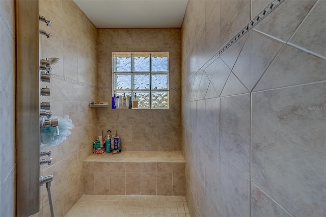 bathroom featuring a tile shower