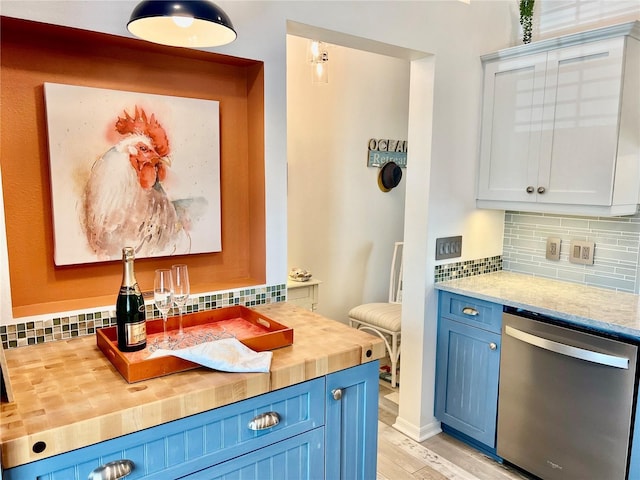 kitchen with tasteful backsplash, wooden counters, dishwasher, light hardwood / wood-style floors, and white cabinets