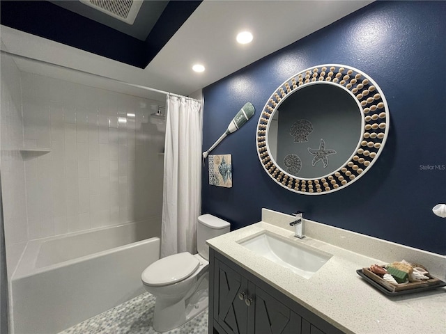 full bathroom featuring shower / bath combo, vanity, and toilet