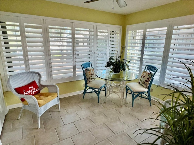 sunroom / solarium with ceiling fan