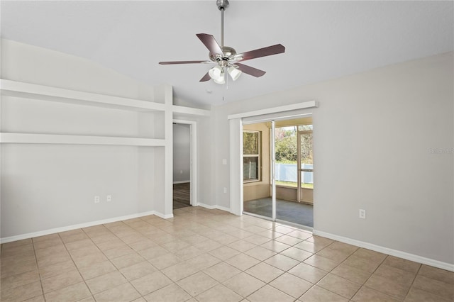 unfurnished bedroom featuring vaulted ceiling, light tile patterned flooring, and ceiling fan