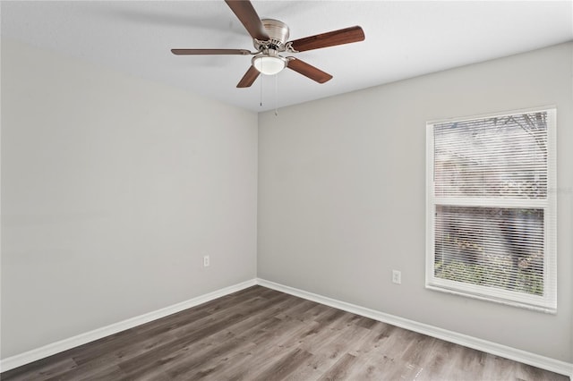 empty room featuring hardwood / wood-style floors and ceiling fan