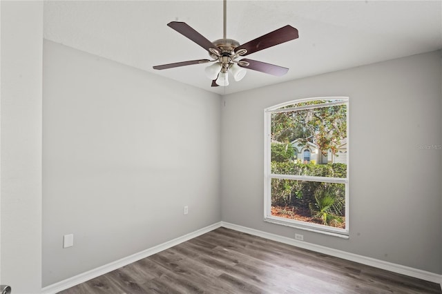 empty room featuring hardwood / wood-style floors and ceiling fan