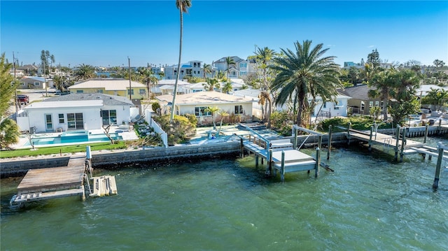 dock area featuring a pool and a water view