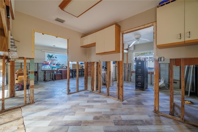 kitchen featuring cream cabinets, plenty of natural light, and ceiling fan