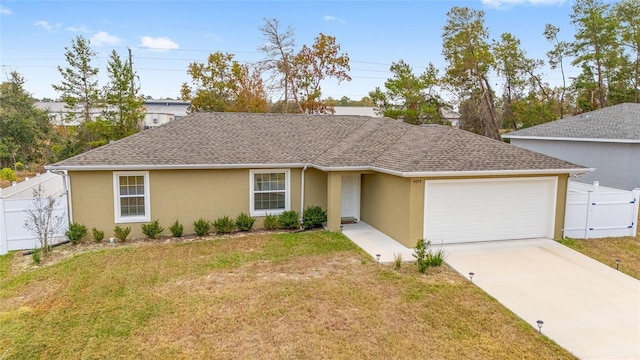 ranch-style home featuring a garage and a front lawn