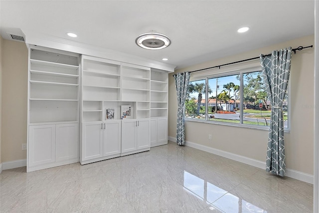 empty room with built in shelves