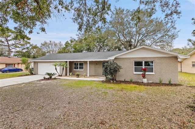 single story home featuring a garage and a front lawn