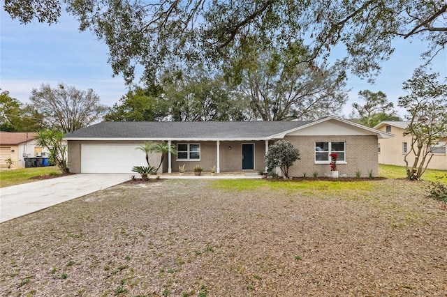 ranch-style home featuring a garage and a front yard