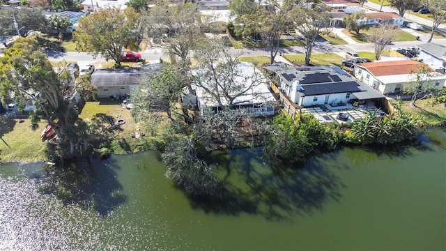 drone / aerial view featuring a water view and a residential view