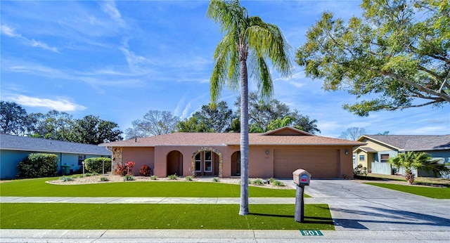 single story home with a garage and a front yard