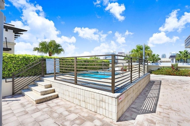 view of patio featuring a fenced in pool