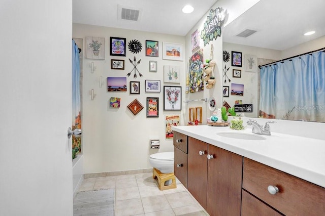 full bathroom with vanity, tile patterned floors, shower / bath combo with shower curtain, and toilet