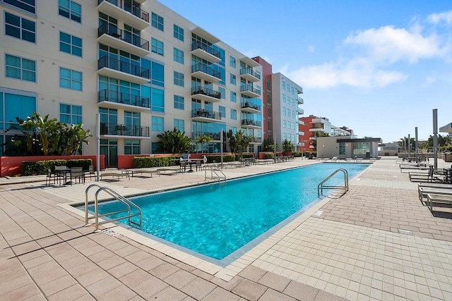 view of swimming pool with a patio area