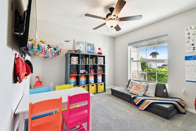 recreation room with carpet and ceiling fan