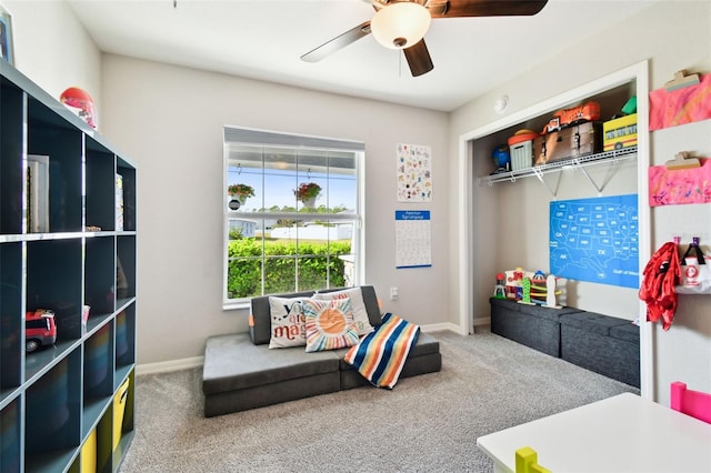 recreation room featuring ceiling fan and carpet flooring