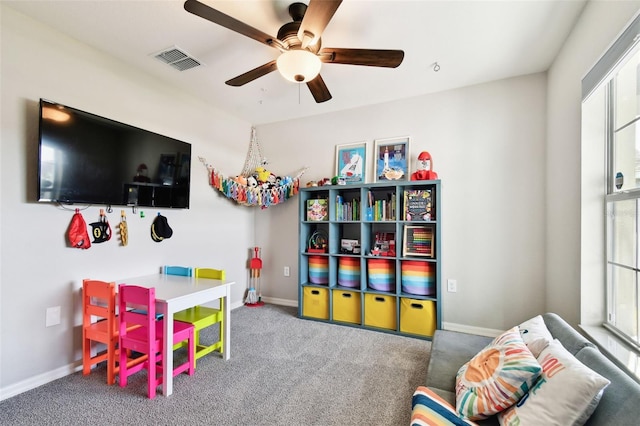 recreation room featuring plenty of natural light, carpet, and ceiling fan