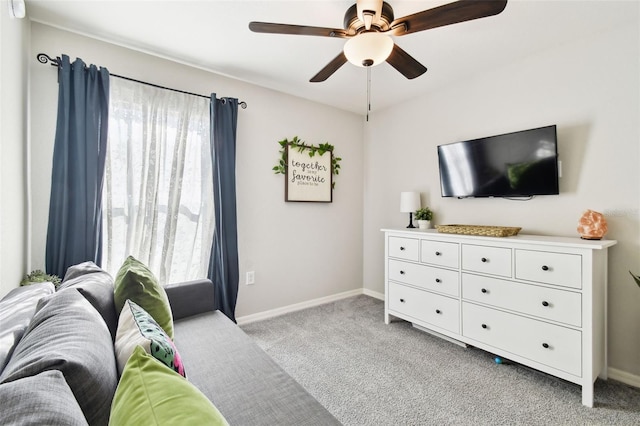 interior space with ceiling fan