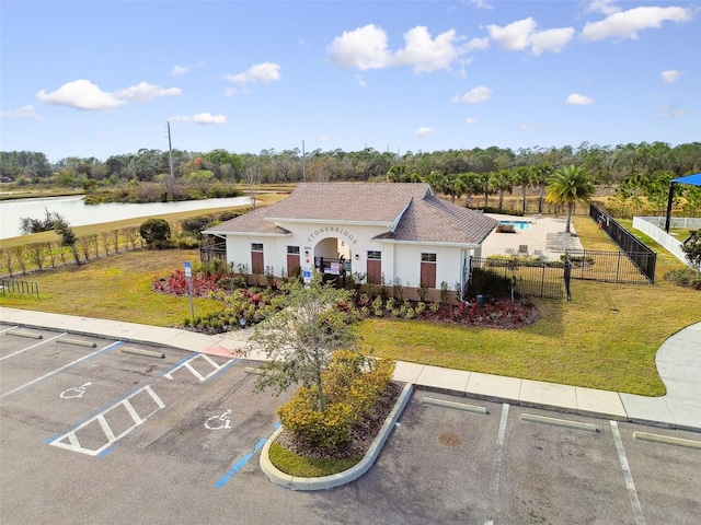 birds eye view of property featuring a water view