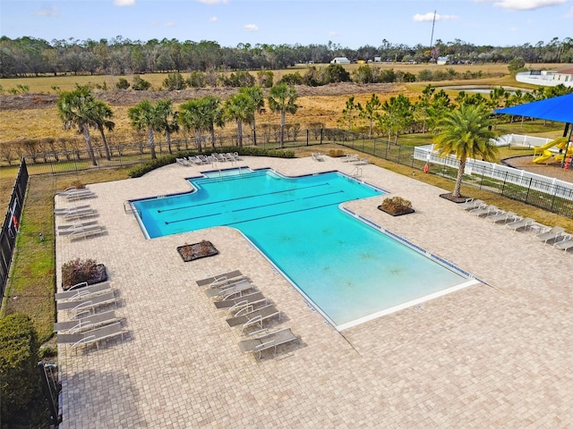 view of swimming pool with a patio area