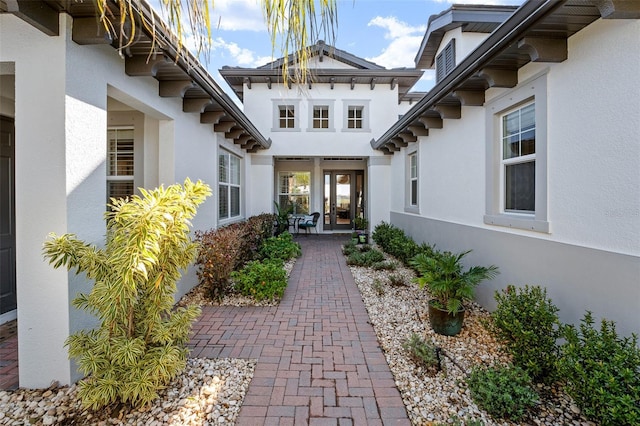 entrance to property with a patio