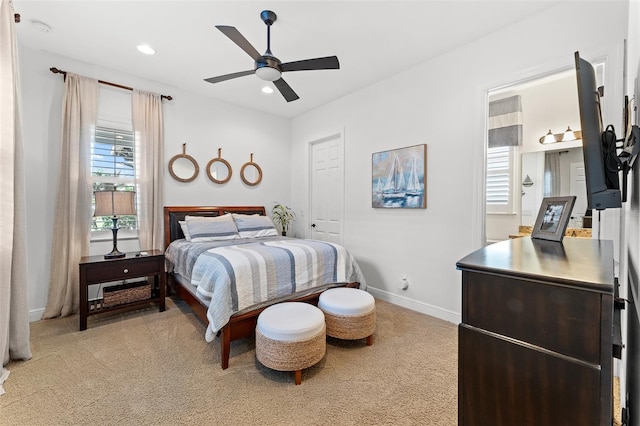 bedroom with light carpet and ceiling fan