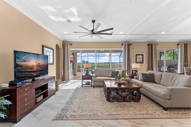 living room featuring ceiling fan and ornamental molding