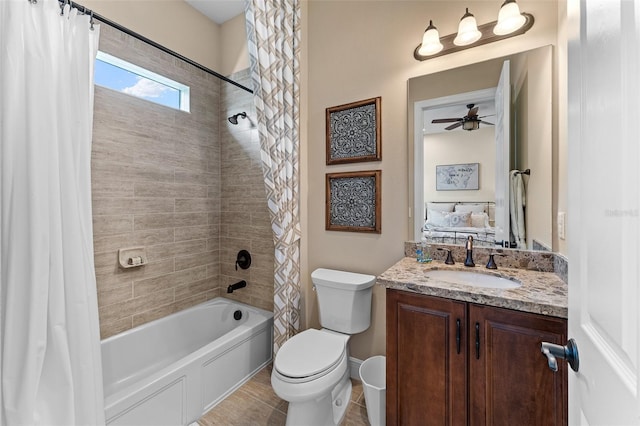 full bathroom with shower / bathtub combination with curtain, ceiling fan, tile patterned flooring, vanity, and toilet