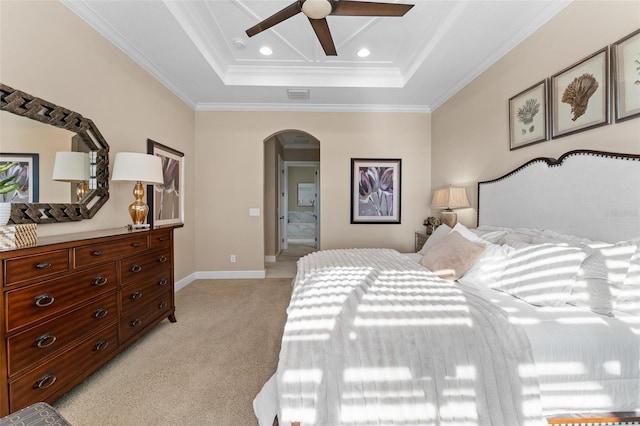 carpeted bedroom featuring crown molding, a raised ceiling, and ceiling fan