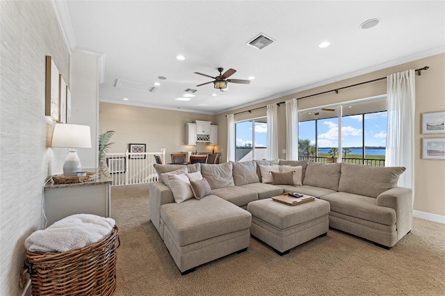 living room featuring ornamental molding, light carpet, and plenty of natural light